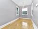 Bright dining room features hardwood floors and a chandelier at 1300 E Kaley St, Orlando, FL 32806