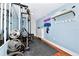 Home gym with weight machine, mirrors, and yoga mats at 1300 E Kaley St, Orlando, FL 32806