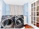 Laundry room with washer, dryer, and French doors at 1300 E Kaley St, Orlando, FL 32806