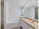 Primary bathroom with double vanity and garden tub at 142 Brushcreek Dr, Sanford, FL 32771