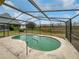 Relaxing screened-in pool area overlooking a tranquil backyard at 142 Brushcreek Dr, Sanford, FL 32771