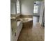 Bathroom with corner bathtub and double vanity at 14324 Fieldstone Lake Way, Orlando, FL 32824