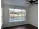 Bedroom with pool view and dark wood flooring at 14324 Fieldstone Lake Way, Orlando, FL 32824