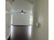 Spacious living room with dark hardwood floors and access to backyard at 14324 Fieldstone Lake Way, Orlando, FL 32824