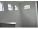 Bright stairwell with multiple windows at 14324 Fieldstone Lake Way, Orlando, FL 32824