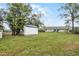 Spacious backyard with a shed and large lawn at 1501 Red Oak Ct, Apopka, FL 32703