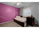 Cozy bedroom with pink walls and a comfortable bed at 1501 Red Oak Ct, Apopka, FL 32703