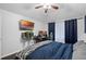 Bedroom with king bed, workspace, and dark blue accents at 1501 Red Oak Ct, Apopka, FL 32703