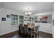 Dining room with a wood table and six chairs, large mirror at 1501 Red Oak Ct, Apopka, FL 32703