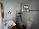 Bathroom with toilet, sink, and shower at 1504 Laun Pl, Lakeland, FL 33803