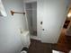 Bathroom with shower, toilet and small cabinet at 1504 Laun Pl, Lakeland, FL 33803