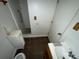 Small bathroom with toilet, sink and shower at 1504 Laun Pl, Lakeland, FL 33803