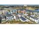 Aerial view of community, highlighting various homes at 1549 Corolla Ct, Reunion, FL 34747