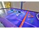 An air hockey table adds to the entertainment options in this fun game room at 1549 Corolla Ct, Reunion, FL 34747