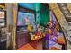 Fun game room featuring a racing arcade game with immersive graphics and realistic controls at 1549 Corolla Ct, Reunion, FL 34747