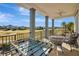 Balcony with foosball table and scenic golf course view at 1549 Corolla Ct, Reunion, FL 34747