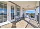 Relaxing balcony with patio furniture and golf course views at 1549 Corolla Ct, Reunion, FL 34747