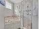 Bathroom with soaking tub and walk-in shower at 1549 Corolla Ct, Reunion, FL 34747