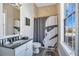 Clean and bright bathroom with a Star Wars-themed shower curtain at 1549 Corolla Ct, Reunion, FL 34747