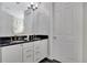 Bathroom with double vanity and granite countertop at 1549 Corolla Ct, Reunion, FL 34747
