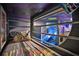 Bunk bed with a built-in slide in a themed bedroom at 1549 Corolla Ct, Reunion, FL 34747