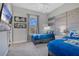Guest bedroom with two twin beds, TV, and Star Wars decor at 1549 Corolla Ct, Reunion, FL 34747