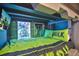 Upper bunk bed with superhero-themed bedding and decor at 1549 Corolla Ct, Reunion, FL 34747