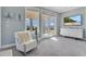 Bedroom with large windows and water view at 1549 Corolla Ct, Reunion, FL 34747