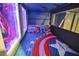 Upper bunk bed with Captain America bedding and decor at 1549 Corolla Ct, Reunion, FL 34747
