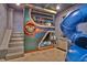 Bunk bed with stairs and a slide in a themed bedroom at 1549 Corolla Ct, Reunion, FL 34747