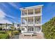 Three-story house with balconies and backyard patio at 1549 Corolla Ct, Reunion, FL 34747