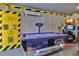 Game room with air hockey, racing games, and other arcade games at 1549 Corolla Ct, Reunion, FL 34747