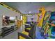 Game room with a large TV, comfy seating, and arcade games at 1549 Corolla Ct, Reunion, FL 34747