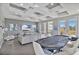 Game room with poker table, large TV, and seating area at 1549 Corolla Ct, Reunion, FL 34747