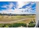 View from balcony showcasing a beautiful golf course at 1549 Corolla Ct, Reunion, FL 34747