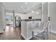 Modern kitchen with island and breakfast bar at 1549 Corolla Ct, Reunion, FL 34747