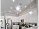 Modern kitchen with stainless steel appliances and white cabinetry at 1549 Corolla Ct, Reunion, FL 34747