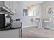 Compact kitchenette with modern appliances and stylish cabinetry at 1549 Corolla Ct, Reunion, FL 34747