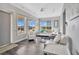 Bright living room with comfy seating and large windows at 1549 Corolla Ct, Reunion, FL 34747