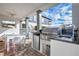 Modern outdoor kitchen with grill, sink and mini fridge at 1549 Corolla Ct, Reunion, FL 34747
