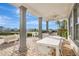 Outdoor patio with dining area, grill, and pool table at 1549 Corolla Ct, Reunion, FL 34747