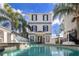 Inviting pool with a spacious deck and a basketball hoop nearby at 1549 Corolla Ct, Reunion, FL 34747