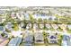 Aerial view of a residential neighborhood with houses, landscaping, and a lake at 16036 River Pointe Ct, Orlando, FL 32828