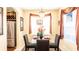 Well-lit dining area featuring a glass-top table and chair set at 16036 River Pointe Ct, Orlando, FL 32828