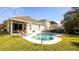 Private kidney shaped pool with spacious patio and lawn at 16036 River Pointe Ct, Orlando, FL 32828