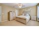 Bedroom with light wood furniture, carpeted floors, and neutral walls at 16583 Cedar Crest Dr, Orlando, FL 32828