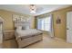 Bedroom with light wood furniture, carpeted floors, and neutral walls at 16583 Cedar Crest Dr, Orlando, FL 32828