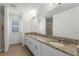 Modern bathroom with double vanity and granite countertop at 17066 Water Spring Blvd, Winter Garden, FL 34787