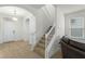 Staircase with white railing and carpeted steps in entryway at 17066 Water Spring Blvd, Winter Garden, FL 34787