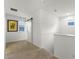 Upstairs hallway with shiplap accent wall and barn door at 17066 Water Spring Blvd, Winter Garden, FL 34787